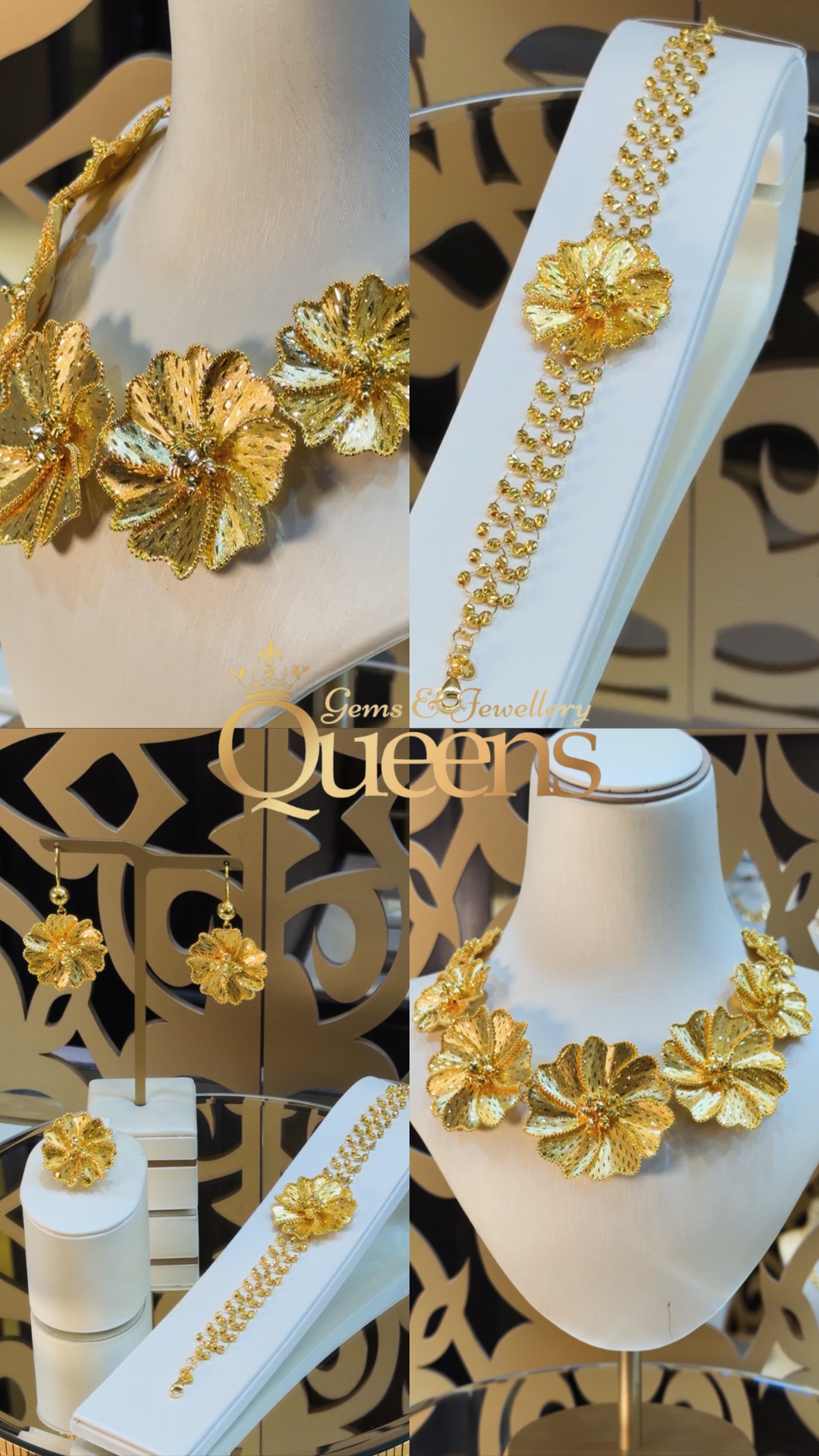 Gold flower necklace, bracelet, earrings and ring on ivory display stands